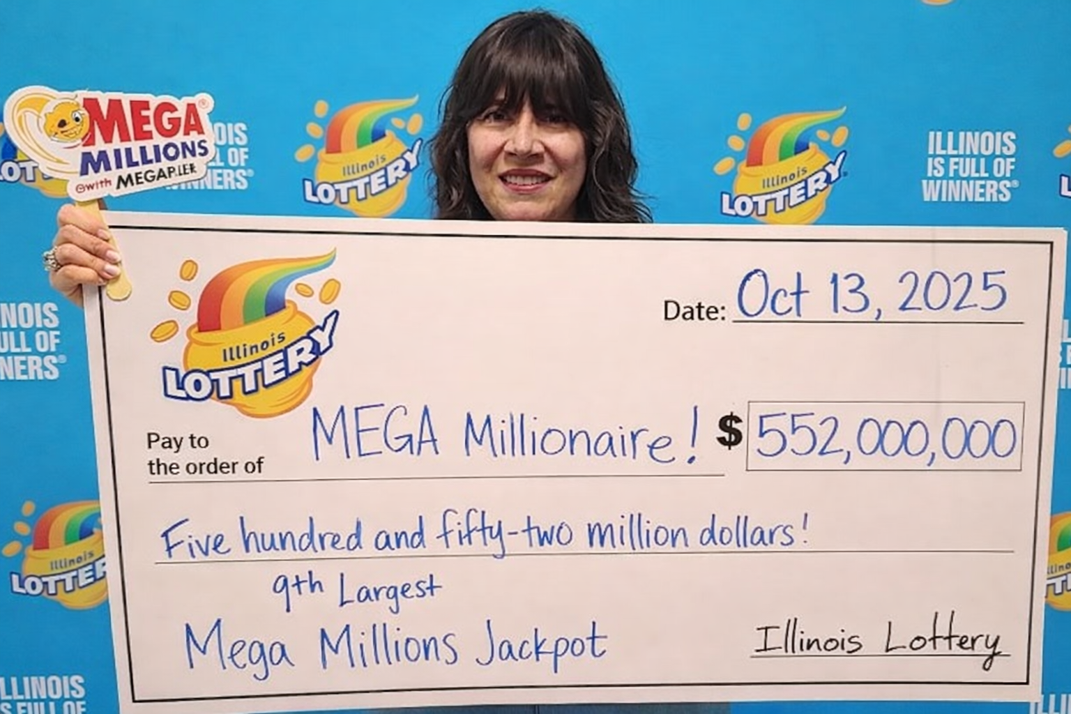 Derek Thompson with winning check